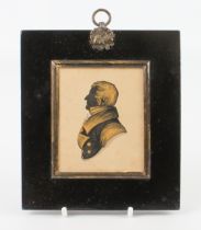 A Regency gilt-highlighted silhouette of a gentleman, 8.5 x 7 cm; frame size 14.8 x 13.1 cm.
