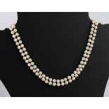 A double row cultured pearl necklace with 9ct gold and pearl clasp - London hallmarks, 43.5 cm