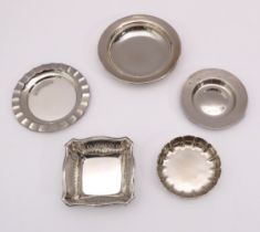 A small group of silver trinket and pip dishes - including a George V dish of square form,