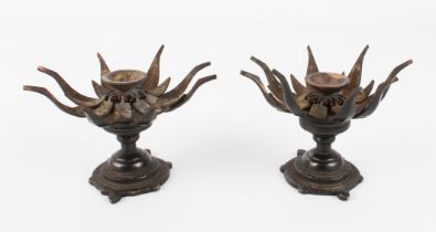 A pair of patinated bronze lotus-form candle holders, possibly Tibetan - probably second half 20th