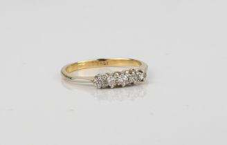 An 18ct yellow gold and diamond five stone ring - marked '18CT', with five claw set brilliant and