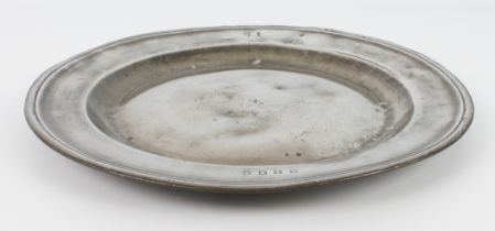 A large 17th or 18th century pewter charger, 38 cm diameter.