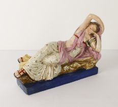 An early 19th century pearlware figure of Cleopatra by Enoch Wood - the reclining figure dressed