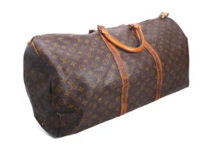 A vintage Louis Vuitton holdall or weekend bag - in classic monogram canvas with tan leather handles