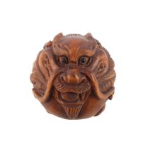 A carved boxwood netsuke