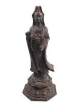 A Chinese cast-iron figure of Guanyin - probably 20th century, on an octagonal lotus base, 28 cm