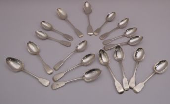 Fourteen 19th century silver fiddle pattern dessert spoons - Georgian and Victorian, various