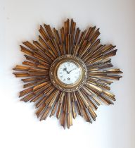 A giltwood sunburst wall clock - 1920s-30s, with 3½ in silvered Roman dial and 30 hour movement,