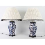 A pair of Oriental blue and white porcelain vase lamps - of hexagonal baluster form, decorated