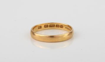 A 22ct yellow gold wedding band - hallmarked London 1958, size N½.