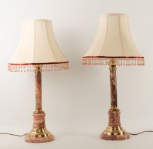 A pair of rouge marble and brass table lamps - modern, of column form, ivory silk shades with beaded