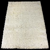 A modern deep pile cream wool rug - 240 x 175 cm.