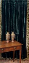 A pair of handmade bottle green, antique style velvet curtains with matching covered pelmet; lined