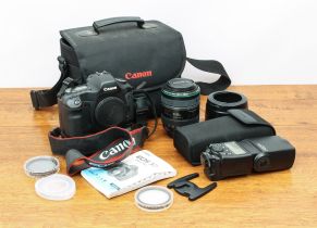 A Canon EOS 5D DSLR camera kit - the 5D camera body with BG-E4 Battery Grip, Canon Ultrasonic EF