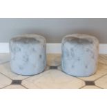 A pair of drum-form pouffes or stools - modern, in ice-blue buttoned upholstery, 48 cm diameter,