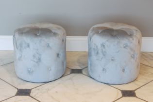 A pair of drum-form pouffes or stools - modern, in ice-blue buttoned upholstery, 48 cm diameter,