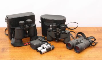 Two pairs of Pentax binoculars - comprising a pair of 10x42 DCF binoculars (no case); and a pair