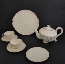 A Belleek Neptune pattern part tea service - gold/brown 7th period (1980-1992) and blue 8th