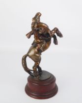 A circa 1900 bronze figure of a Moor warrior holding a shield and axe mounted on a rearing horse (