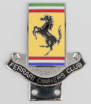 An enamelled Ferrari Owners Club badge with prancing horse logo, 8.5 x 7 cm.