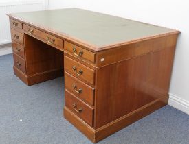 An early 19th century style mahogany double pedestal desk - the moulded top with inset green faux-