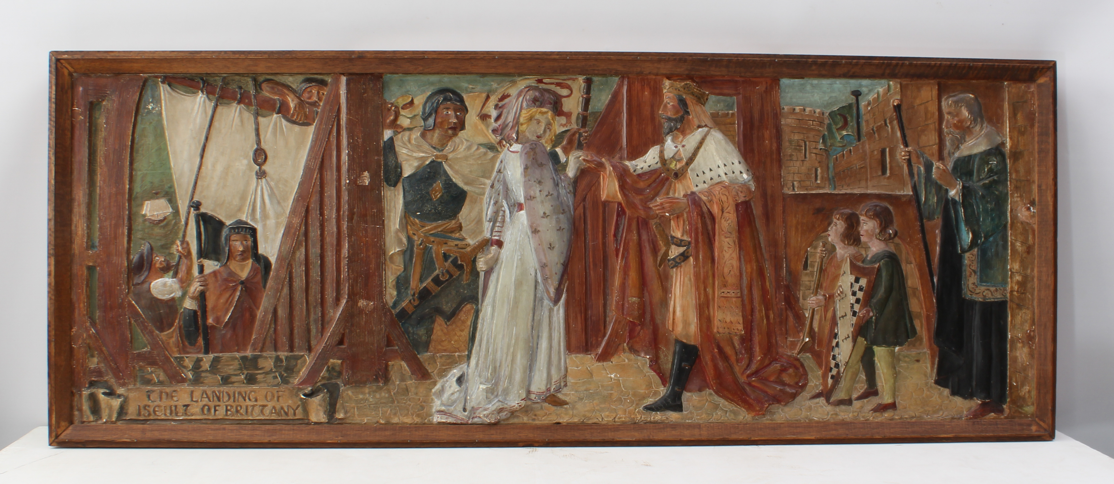 An Arts & Crafts style painted, relief moulded plaster panel depicting 'The Landing of Iseult of