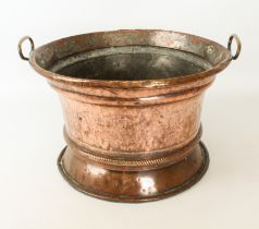 An antique Turkish copper cooking vessel or cauldron with brass carrying handles - probably 19th