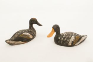 A pair of painted, carved pine decoy ducks - probably early 20th century, painted dark grey, ochre