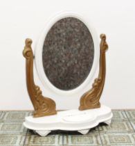 A painted Victorian toilet mirror - the oval plate on foliate scroll carved uprights, to a triform