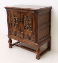 A reproduction carved oak side cabinet in the 17th century style - late 20th century, the moulded,