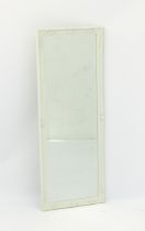 A white painted swept frame dressing mirror - with bevelled plate, 98 x 37 cm.