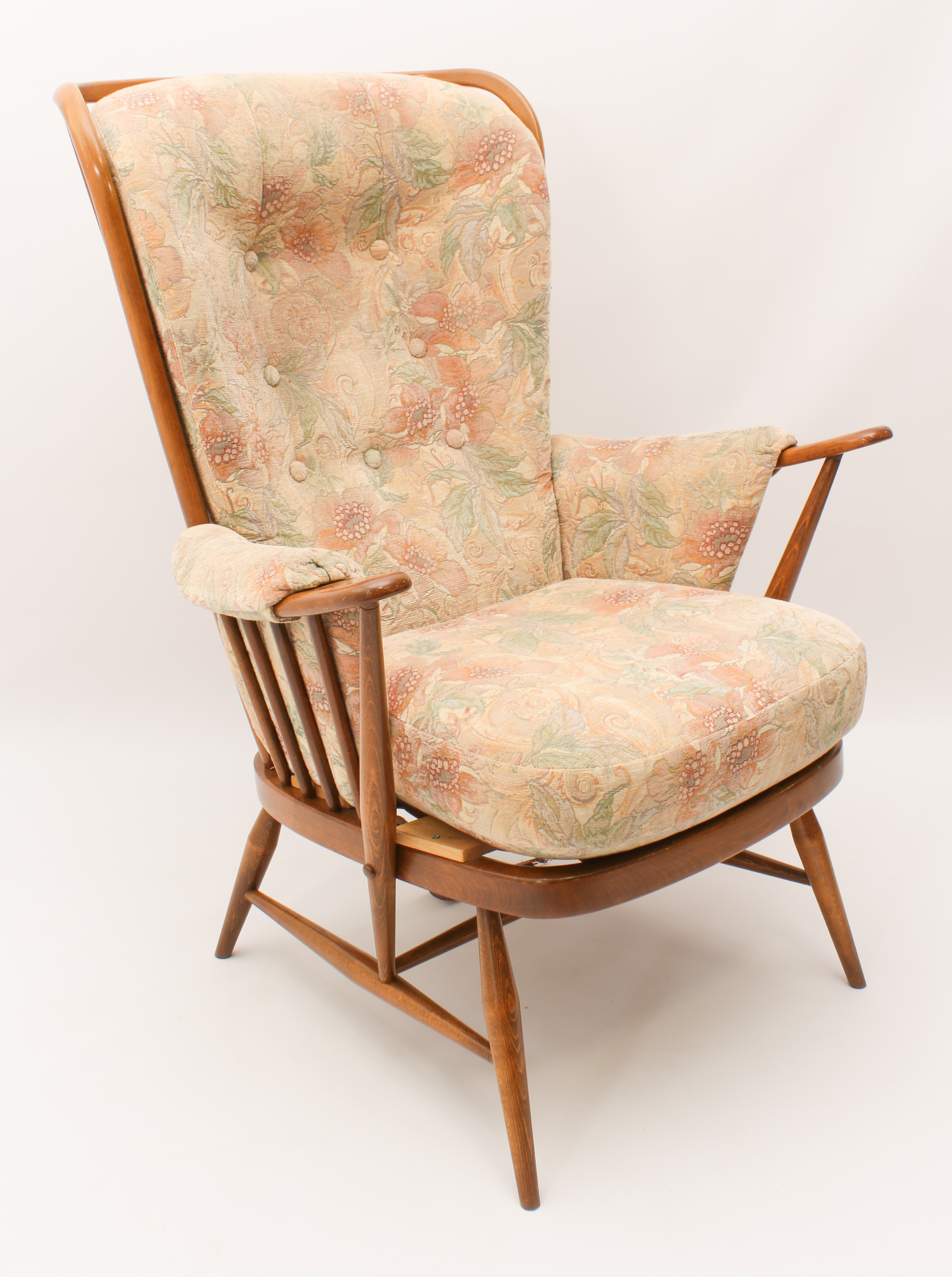 An Ercol Windsor beech wood easy armchair from the Jubilee range - with gold maker's label to