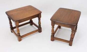 A pair of Ercol Windsor elm drinks or occasional tables - the rounded rectangular tops on baluster