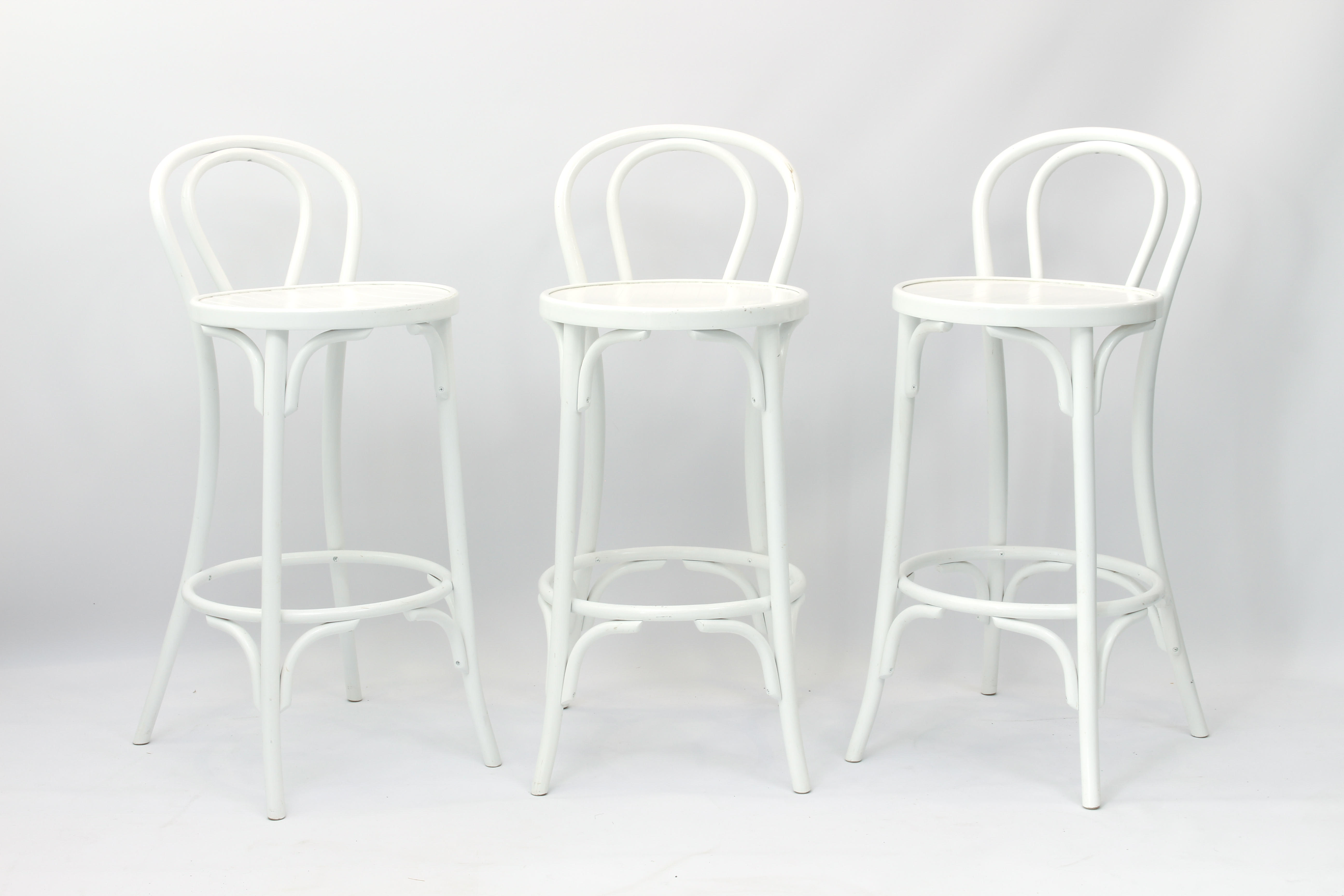 Three white painted bentwood chair-back bar stools - 98 cm high, 74.5 cm high to seat, 41 cm wide.