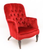 A Victorian / Edwardian tub back armchair - the buttoned back and arms over a serpentine seat,