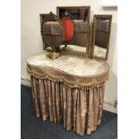 A mid-century walnut kidney-shaped dressing table - with triple plate gilt mirror, two drawers and