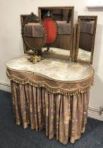 A mid-century walnut kidney-shaped dressing table - with triple plate gilt mirror, two drawers and