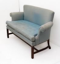 A George III style mahogany two-seater settee - second half 20th century, the slightly concave,