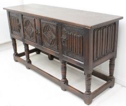 A late 17th century style carved oak dresser base - early 20th century, the plain single-piece top