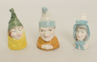 Three Royal Worcester porcelain candle-snuffers: Mr Caudle, Mrs Caudle and Punch
