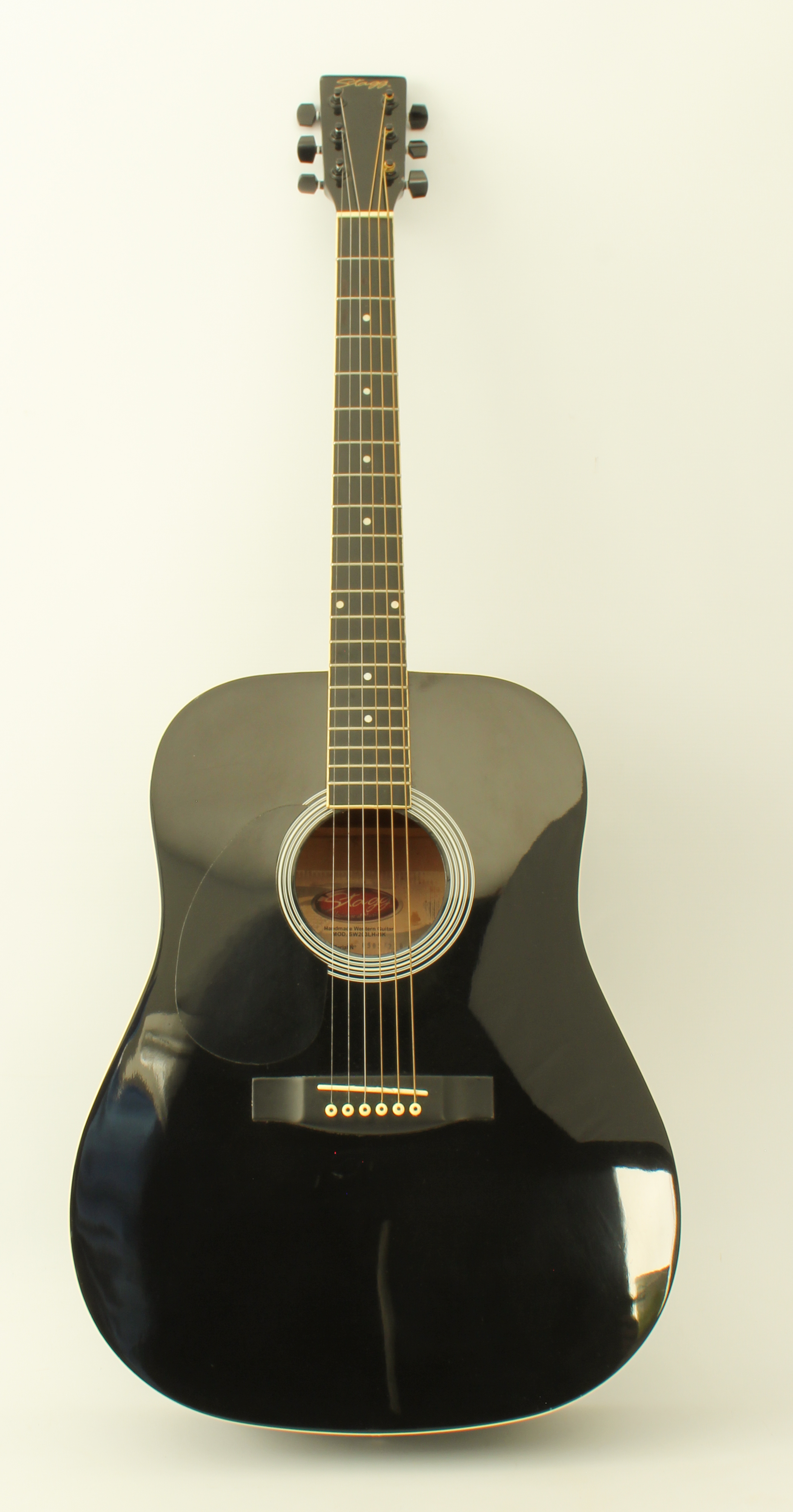 A Stagg black lacquer left-handed six-string acoustic guitar (no. 0503/228), in Ritter soft case (