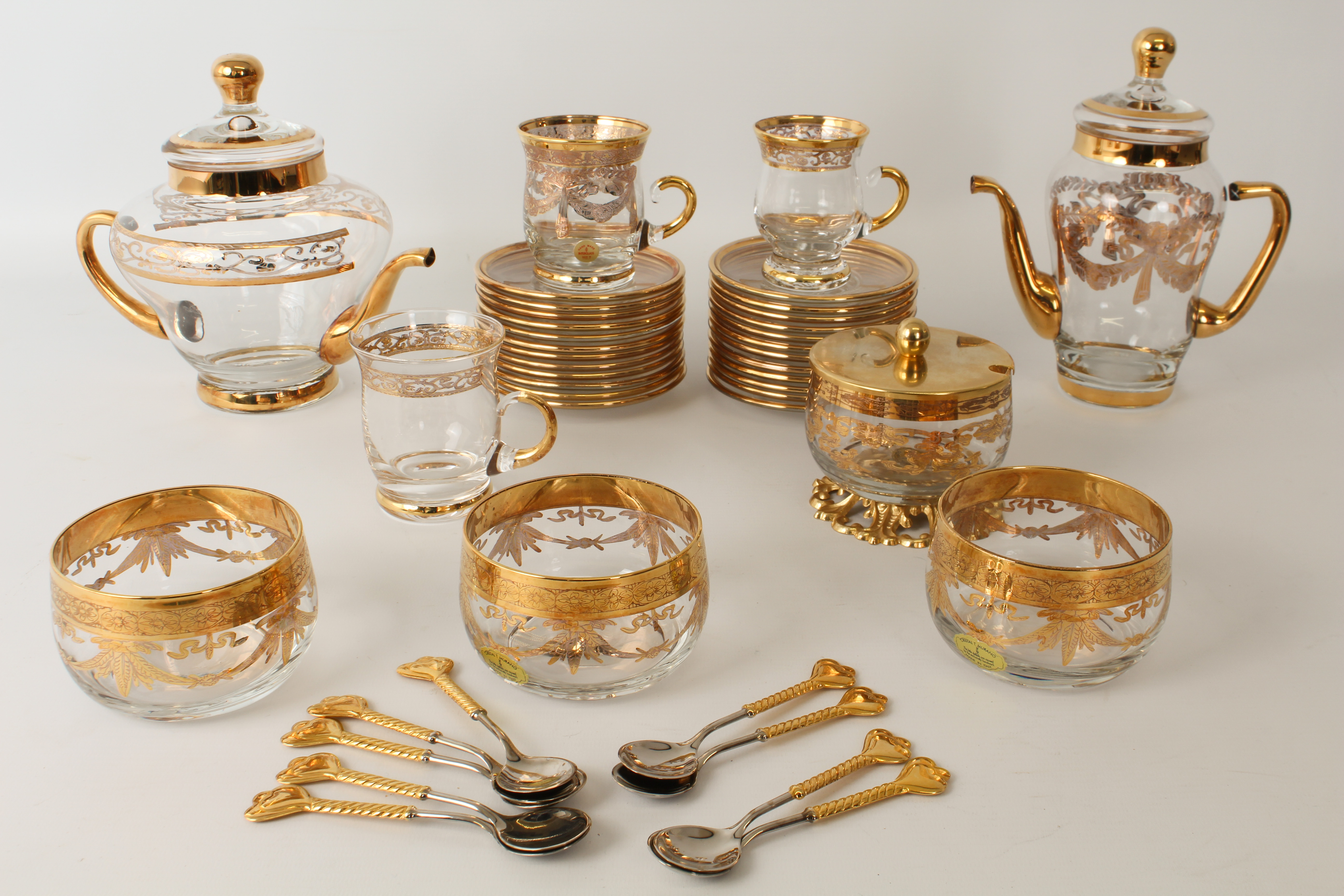 An Italian gilt-decorated glass tea and coffee service in the Florentine taste by Interglass and