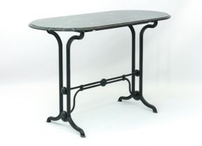 A cast metal and black and white marble conservatory table - the rounded rectangular top on a