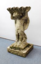 A composite stone garden bird bath - in the form of a cherub carrying a shell, on a square plinth,