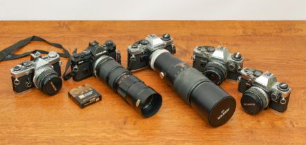 A large collection of Olympus OM Series cameras, lenses and accessories - including an OM2 camera