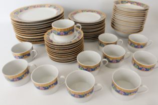 A bone china dinner service by Gipson for 12-place settings - late 20th century; the rims painted