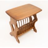 An Ercol Windsor Canterbury or magazine rack table - original maker's labels to underside (LWH 55