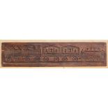 A vintage stained pine panel or mould carved in counter-relief with a steam train - 'Etna', with two