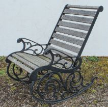 A garden rocking chair - black-painted metal and hardwood  slats