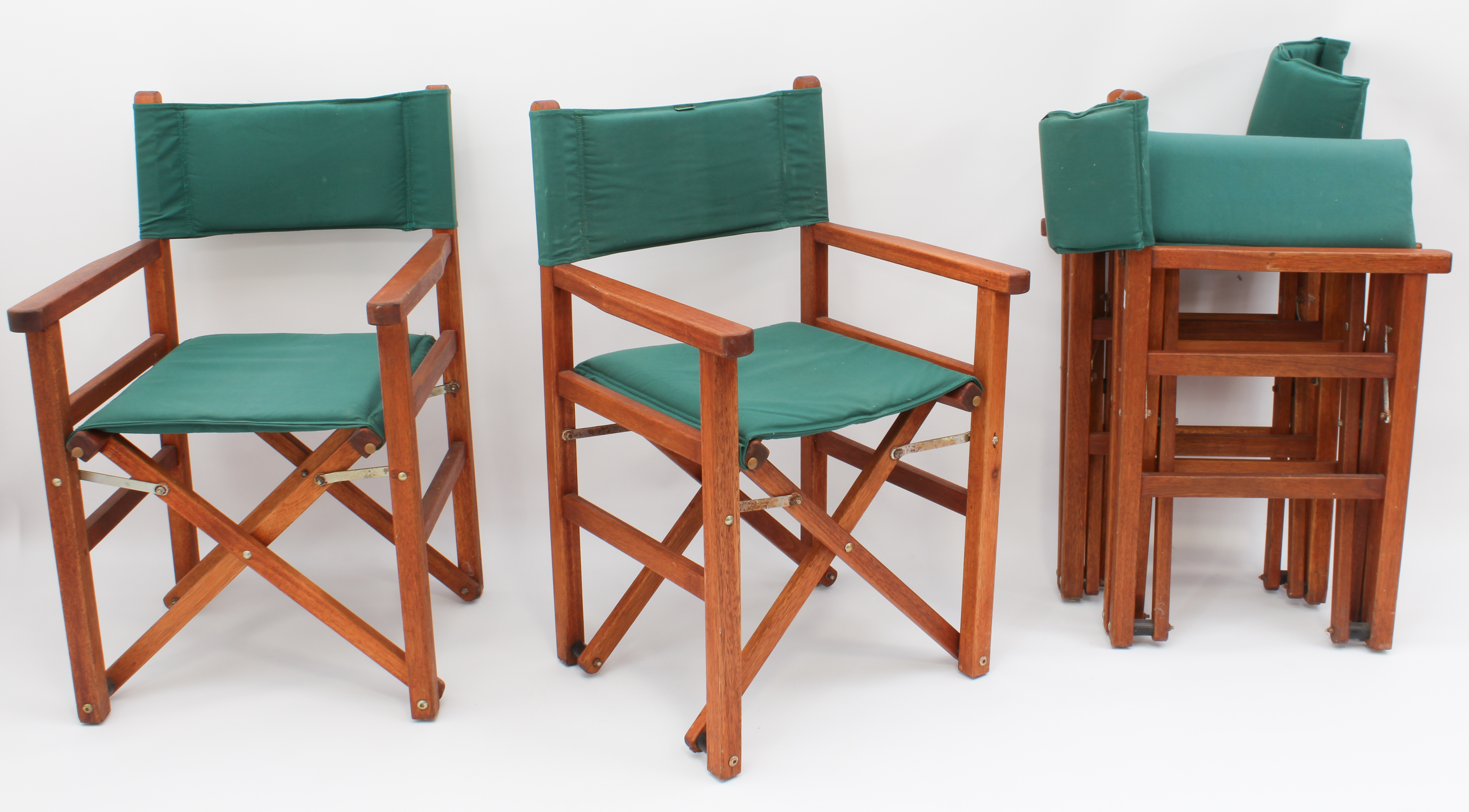 A set of four folding hardwood and green cloth director's style garden chairs by Woodline. (